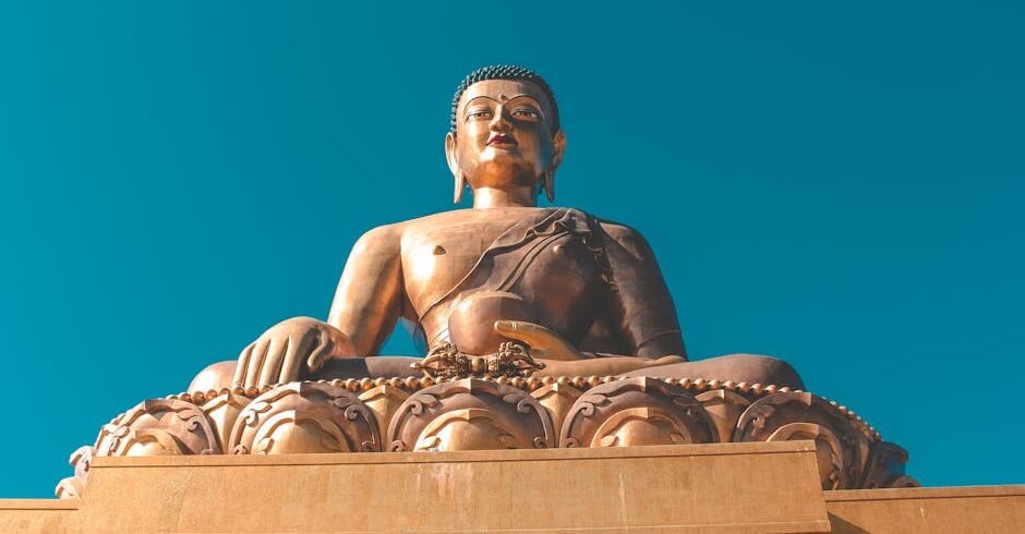 Stunning view of the Buddha Dordenma statue under a clear blue sky in Bhutan.